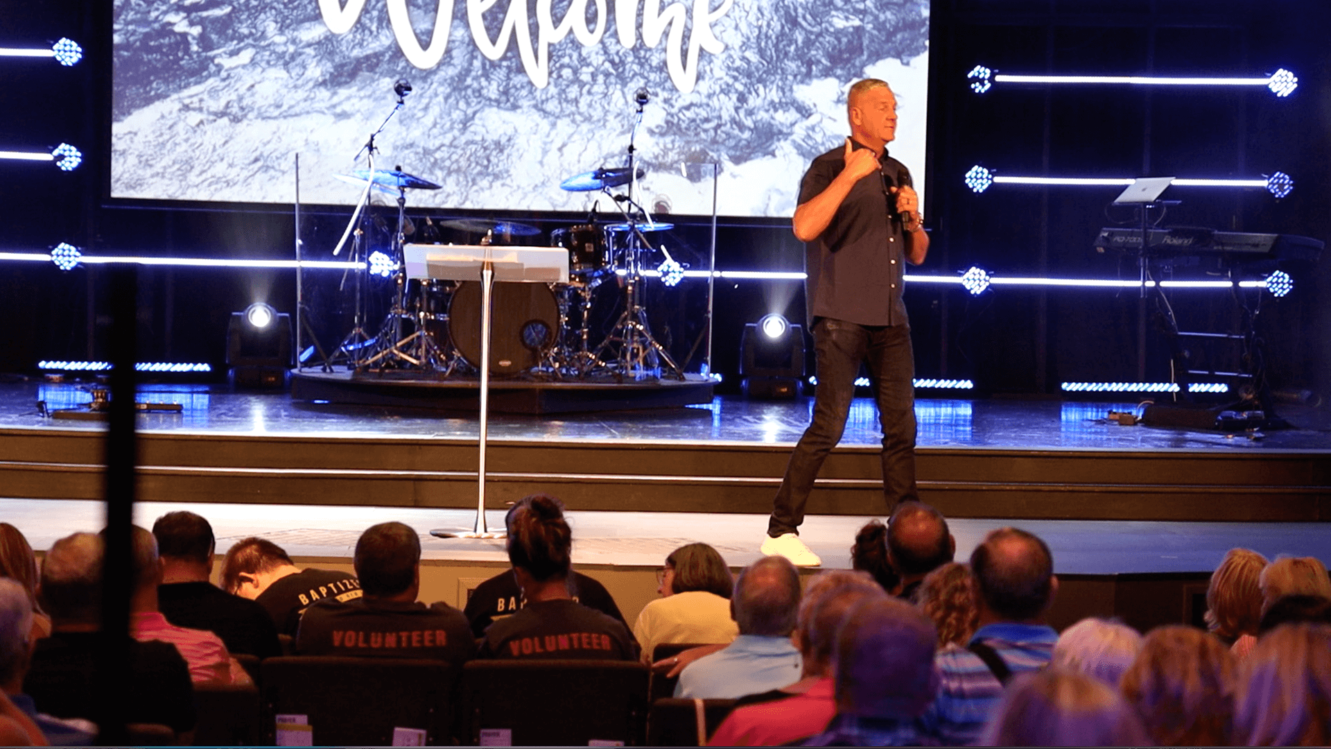 Pastor preaching on stage